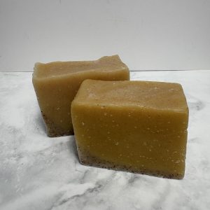 Two bars of orange coloured soap
