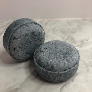 Two round, blue shampoo bars